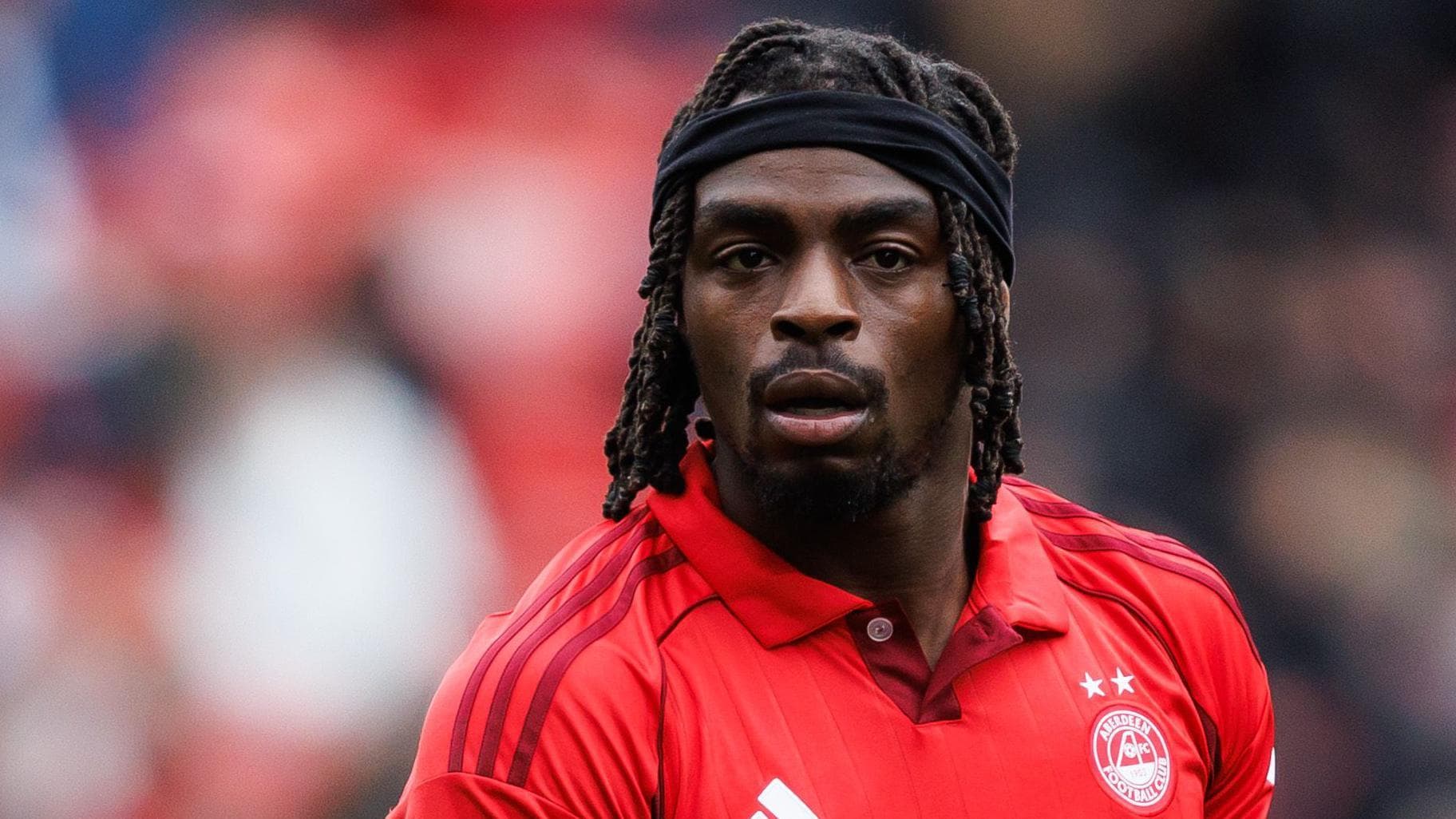 Olusanya 'buzzing to be back' after agreeing Aberdeen deal