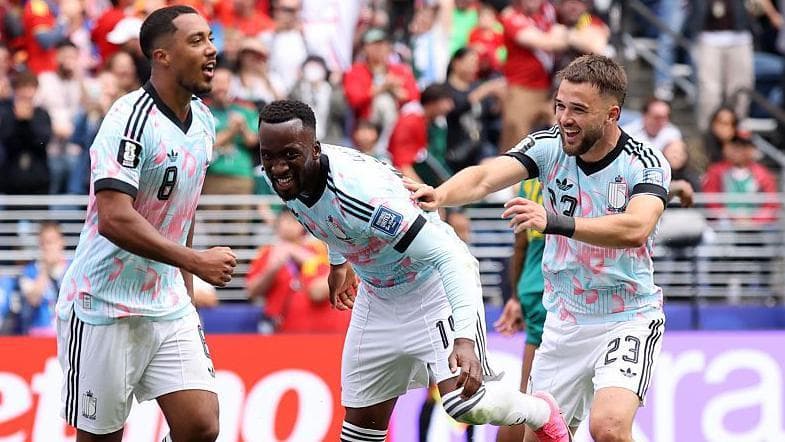 Raskin helps Belgium stage comeback to book last-16 place