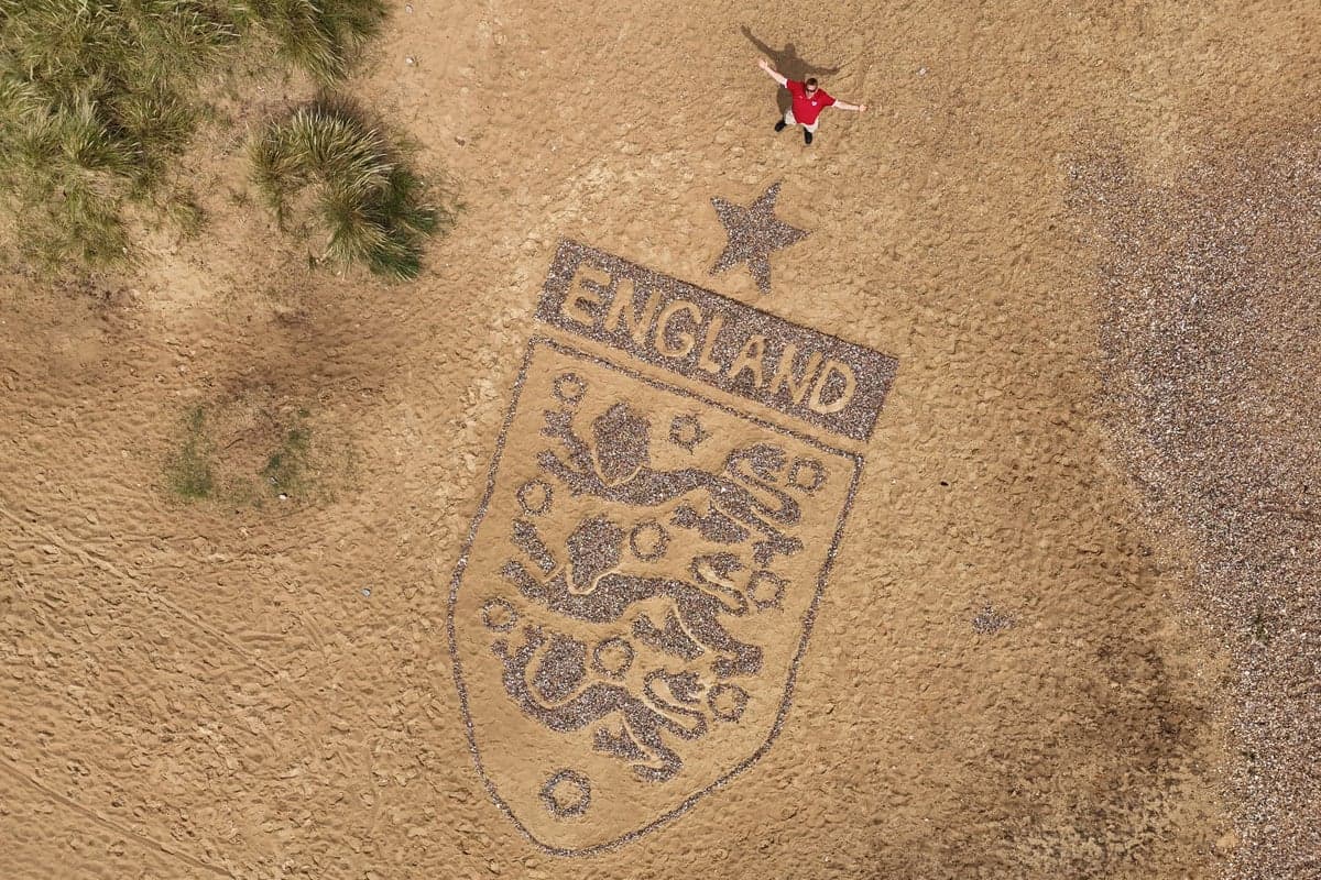 Artist creates 30-foot England badge on Suffolk beach ahead of World Cup clash
